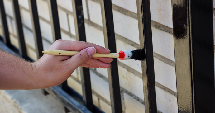 Painting a metal fence